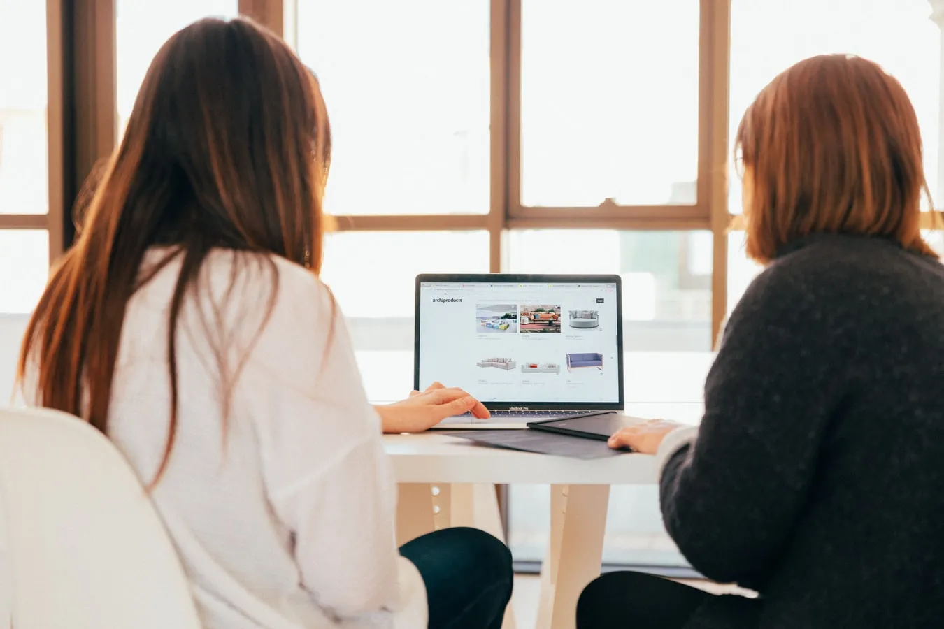 Two women in a computer